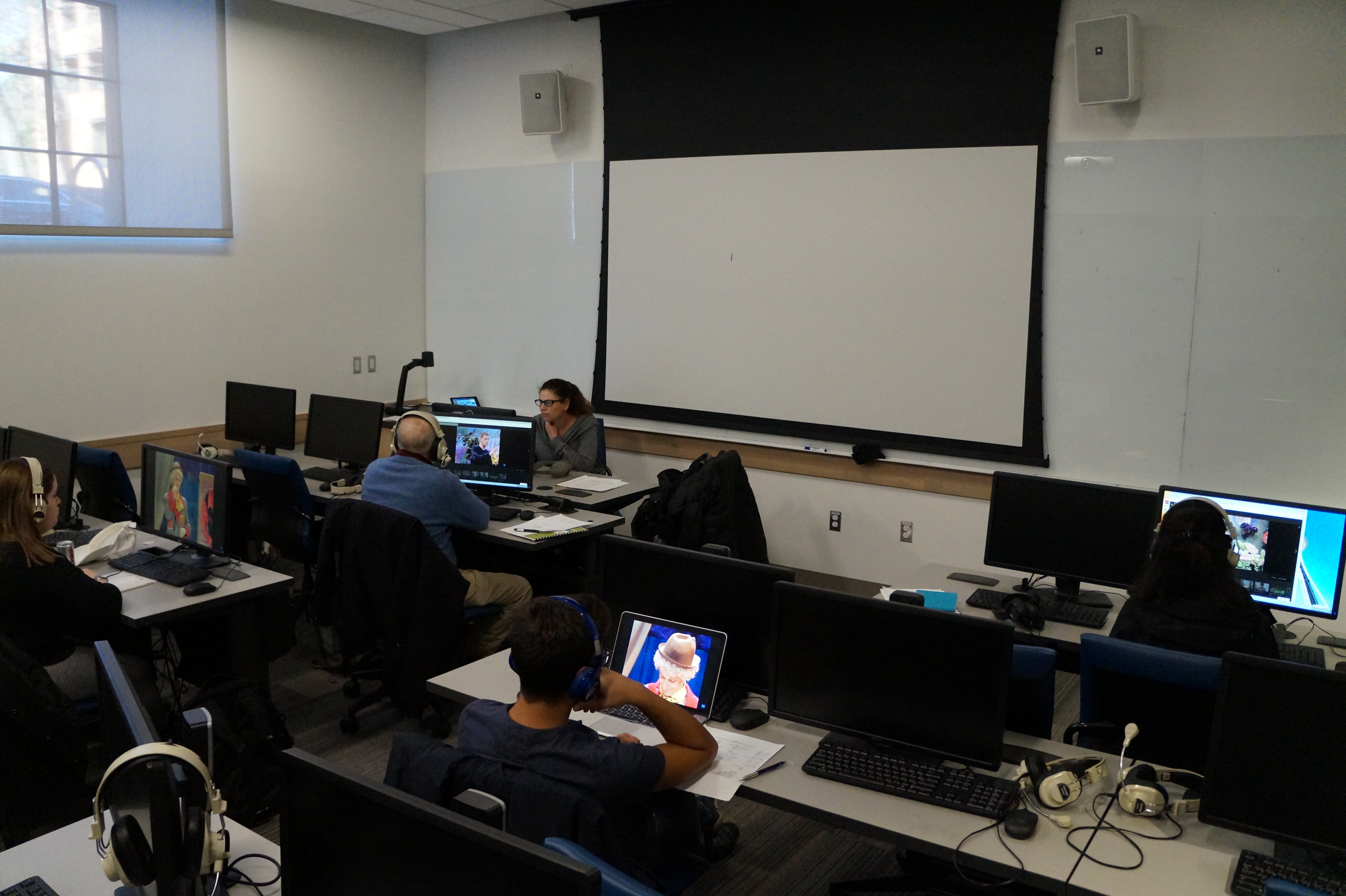 Image from the Language Learning Ctr - students in a room with headphones