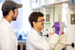 Researchers working at a whiteboard