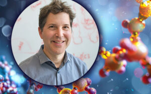 Picture of David Baker in a circle with an illustration of protein molecules in the background