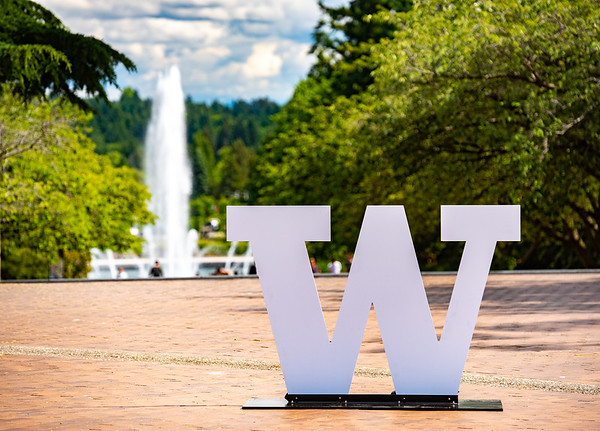 [W logo sign with Drumheller fountain in background]