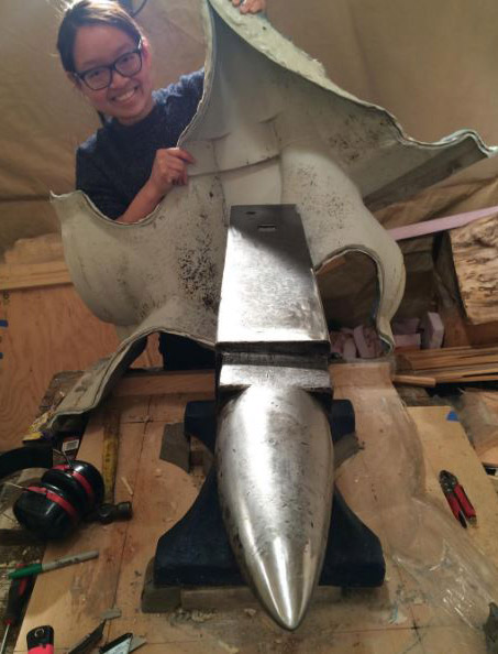 Artist unveiling metal anvil
