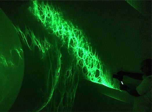 Green light shining on wall