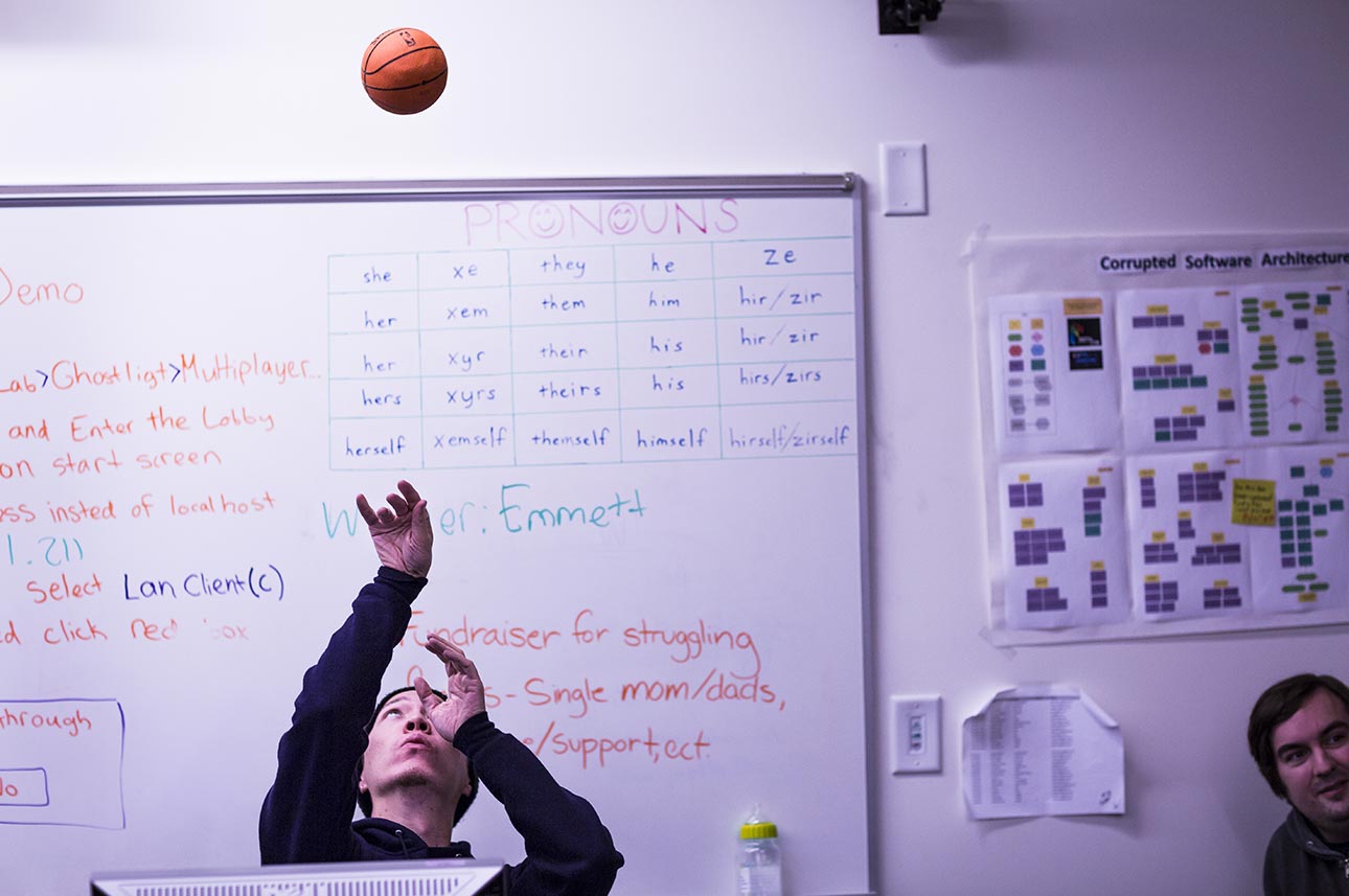 Lead artist Nathan Evers works on his shooting form during a slow moment at the DFL