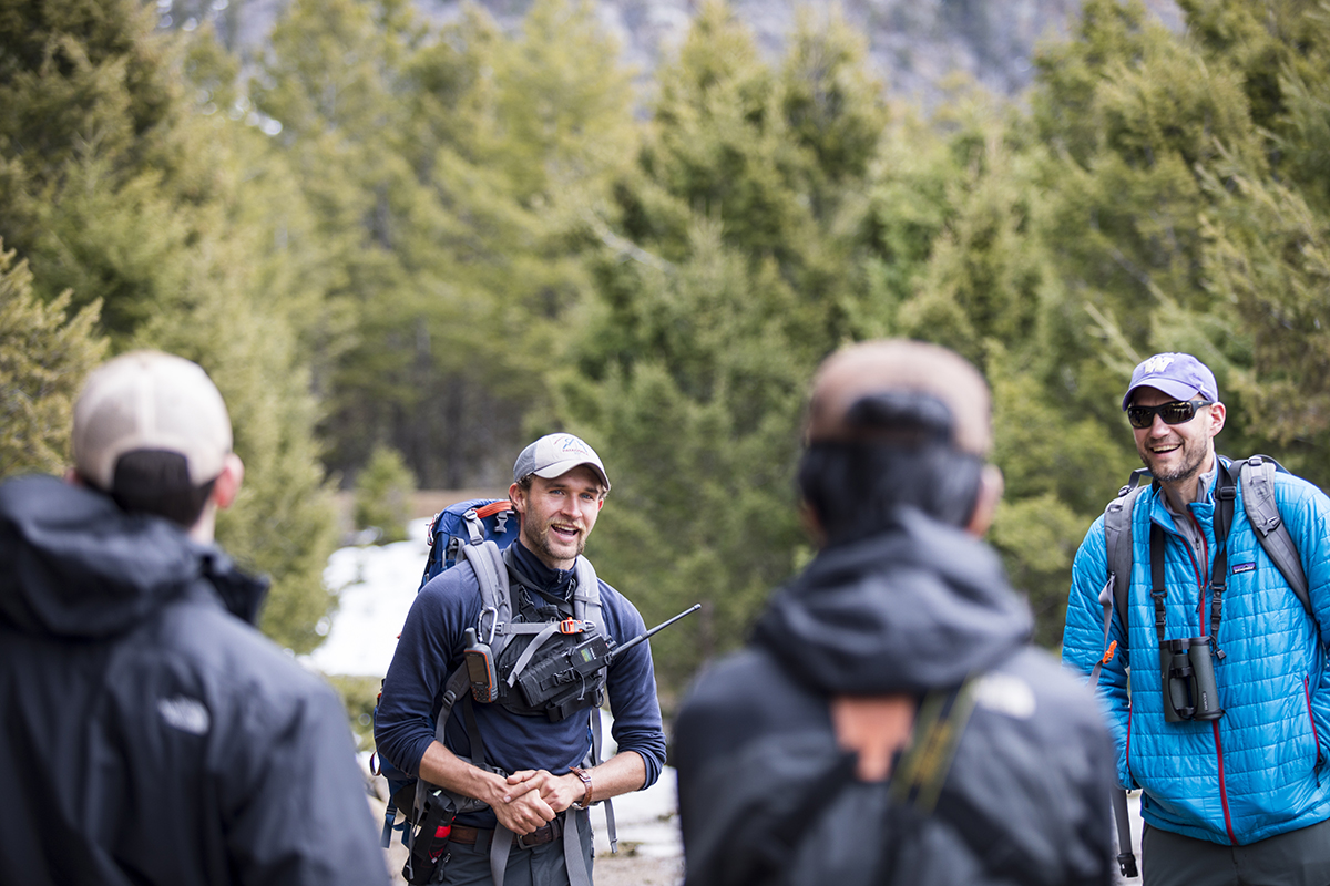 Like Gregory, Connor Meyer (left, facing camera), ’16, took this class as an undergraduate and works in the park as a wildlife technician. He leads Wirsing (right, facing camera) and the rest of the class to the site of a cougar-killed elk.