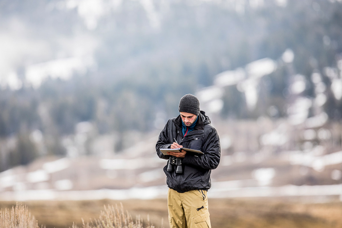 Gavin Forster, ’18,  helps collect data for John Marzluff’s ongoing bird survey.